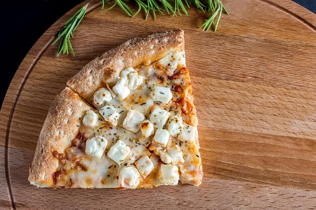 High angle view of pizza on cutting board