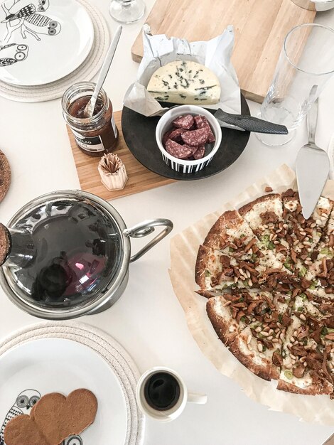 High angle view of pizza served on table