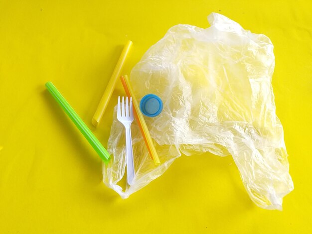 High angle view of plastic bag on yellow background