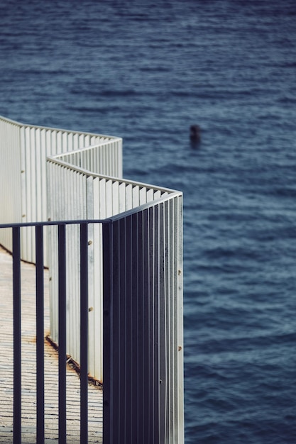 High angle view of railing by sea