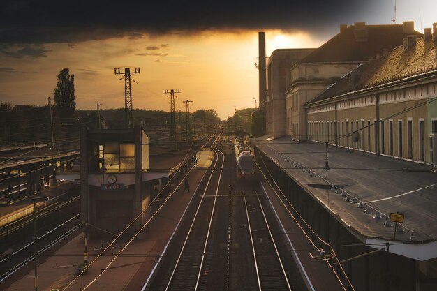 High angle view of railroad station against sky during sunset