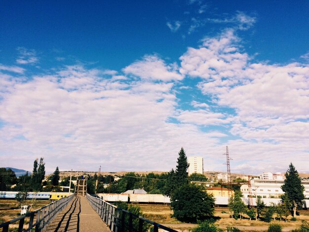 High angle view of railroad tracks against cloudy sky