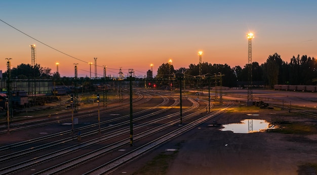 high angle view of railroad tracks against sky at sunset