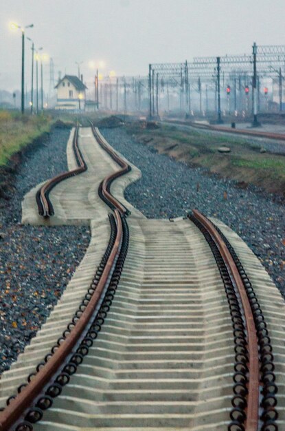 High angle view of railroad tracks in city against sky