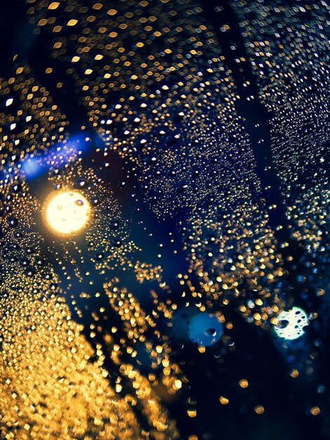 High angle view of raindrops on glass