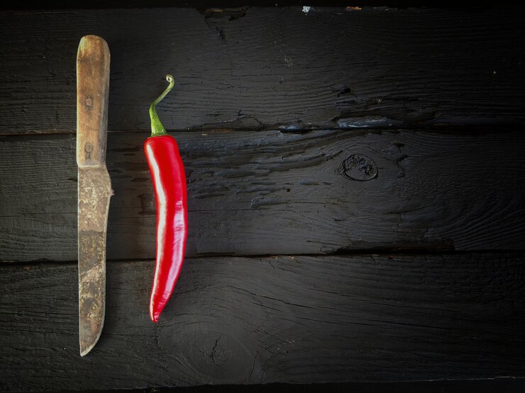 Photo high angle view of red chili pepper on table