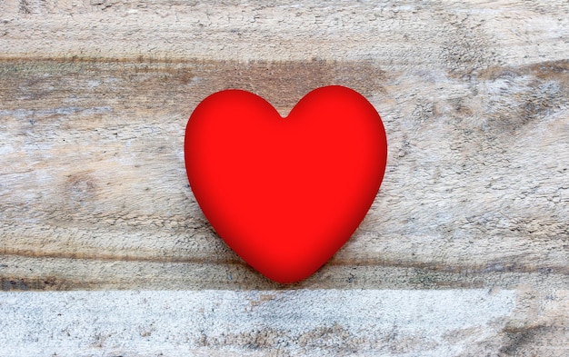 Photo high angle view of red heart shape on wooden table