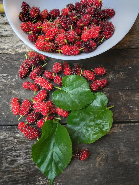 High angle view of red mulberry on table