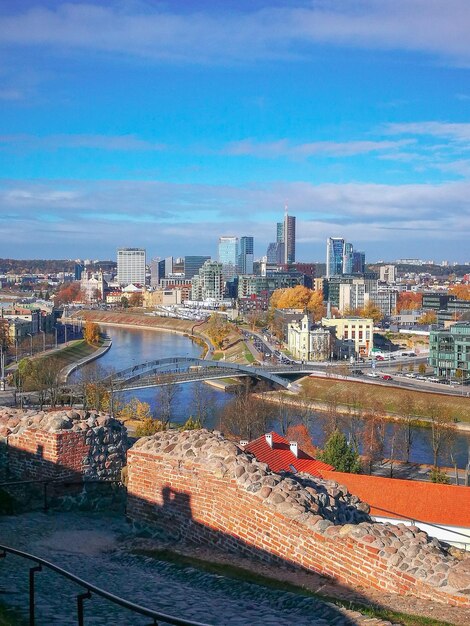 High angle view of river and buildings against sky