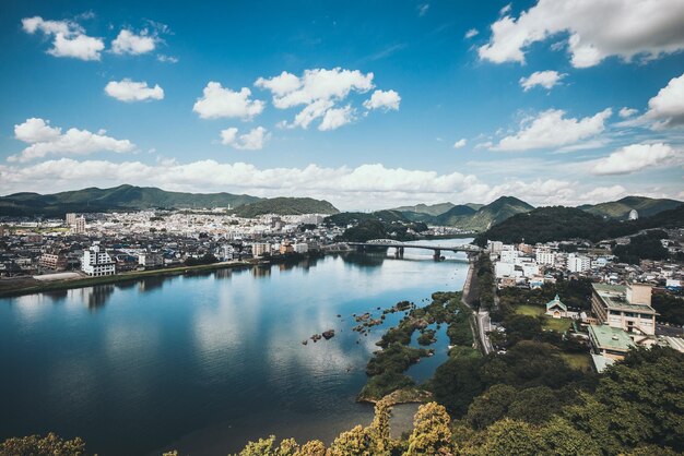 High angle view of river by town against sky