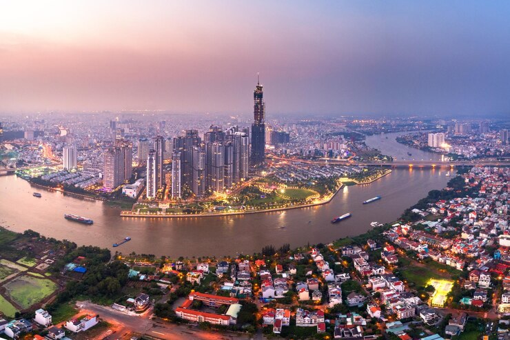 Photo high angle view of river and illuminated buildings in city