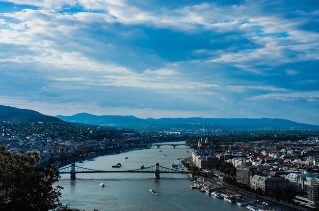 High angle view of river and townscape against sky