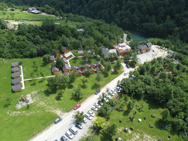 High angle view of road amidst trees and buildings