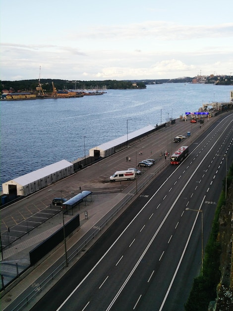 High angle view of road by sea against sky