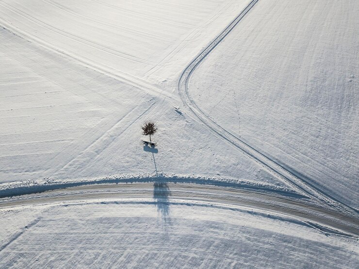 Photo high angle view of road on field during winter