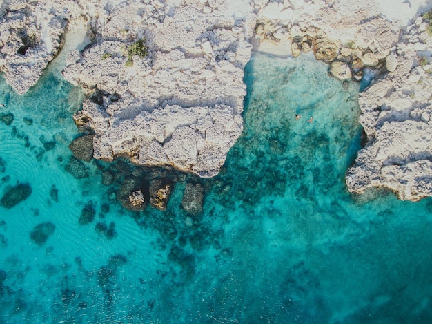 High angle view of rock by sea