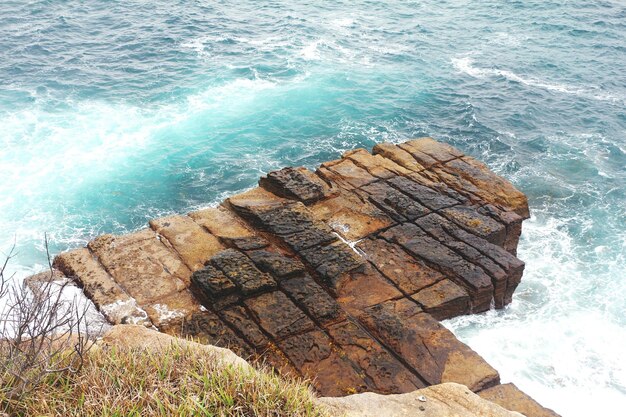 High angle view of rock formation in sea