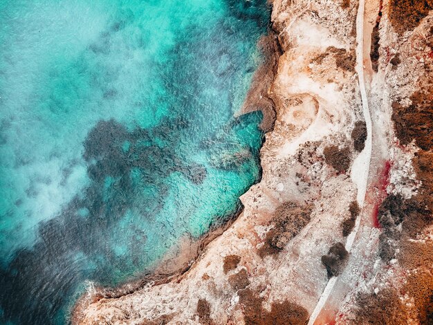 High angle view of rock formation in sea