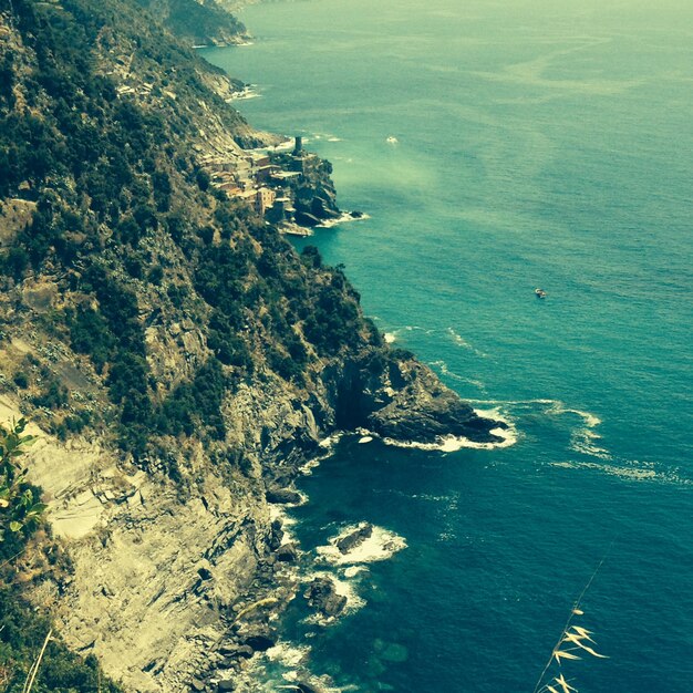 High angle view of rock mountains by sea