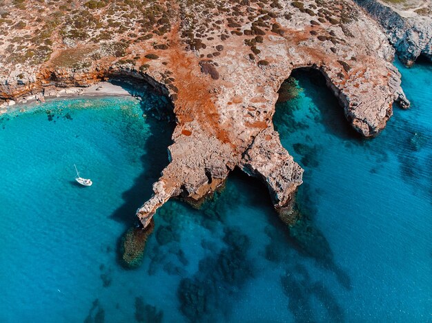 High angle view of rock on sea shore