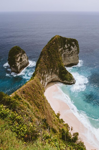 High angle view of rocks on beach against sky