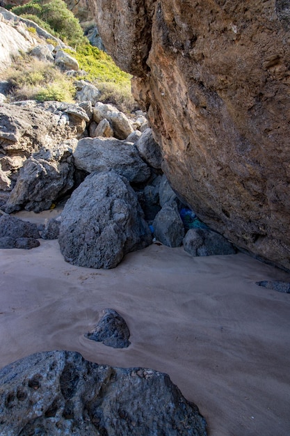 High angle view of rocks on sea shore