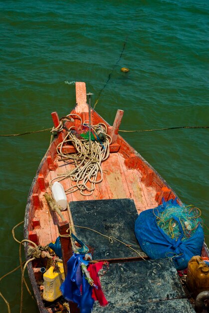 High angle view of rope tied to fishing boat