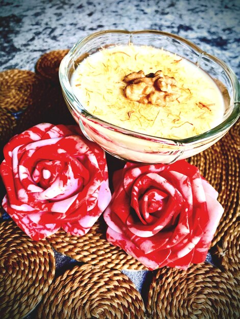 High angle view of roses in jar on table