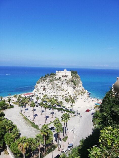 High angle view of sea against clear blue sky