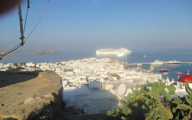 High angle view of sea and buildings against sky