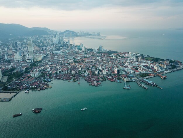 High angle view of sea and buildings against sky