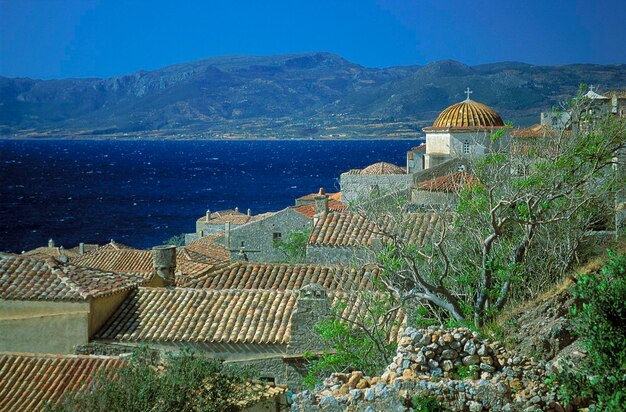 High angle view of sea and buildings against sky