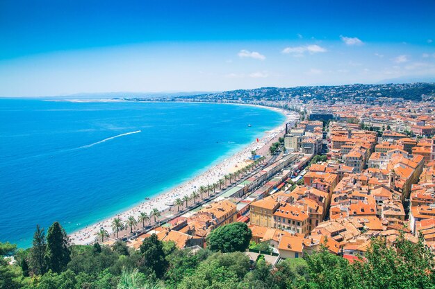 High angle view of sea and cityscape against sky