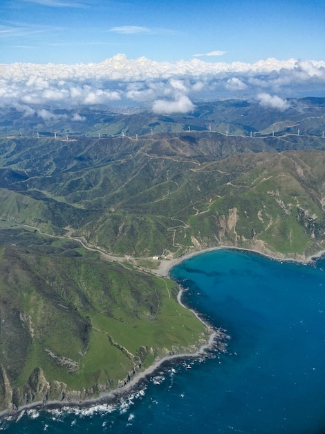 high angle view of sea and mountains against sky
