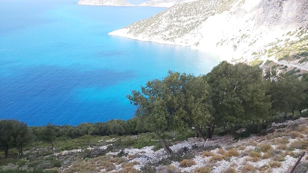 High angle view of sea and mountains against sky