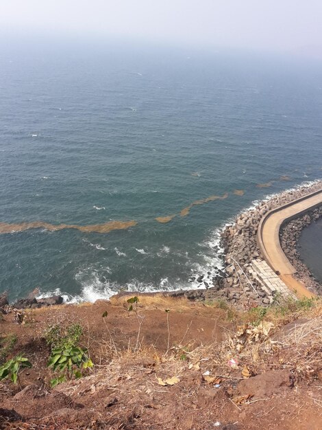 High angle view of sea shore against sky