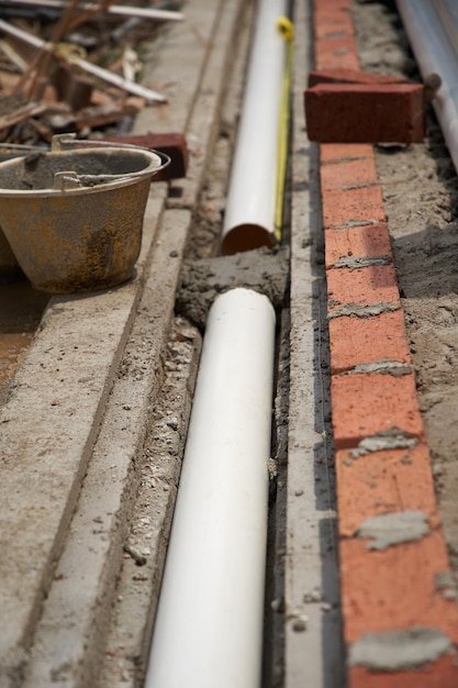 Photo high angle view of  sewerage pipes under construction