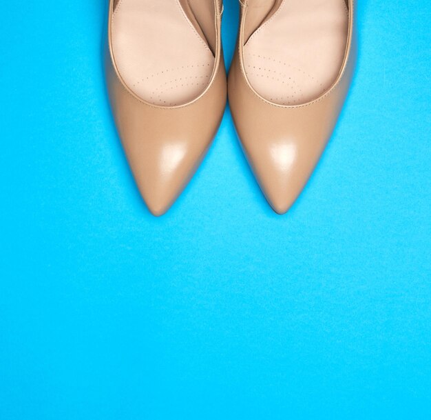 High angle view of shoes on blue background