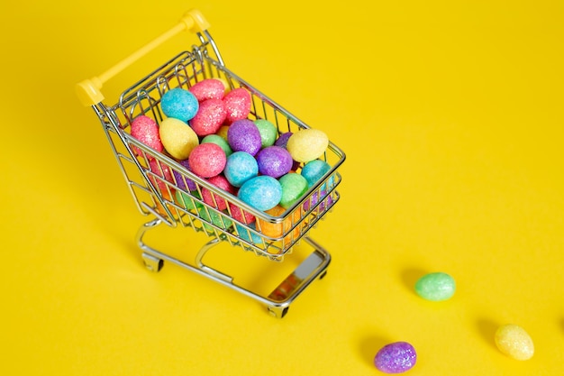 High angle view of shopping cart against yellow background