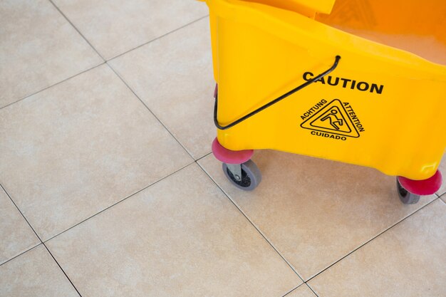 High angle view of sign on mop bucket