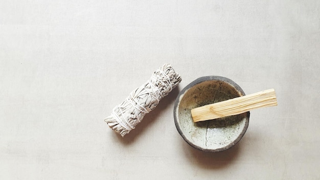 High angle view of smudge stick in bowl on table