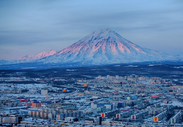 High angle view of snowcapped mountains against sky