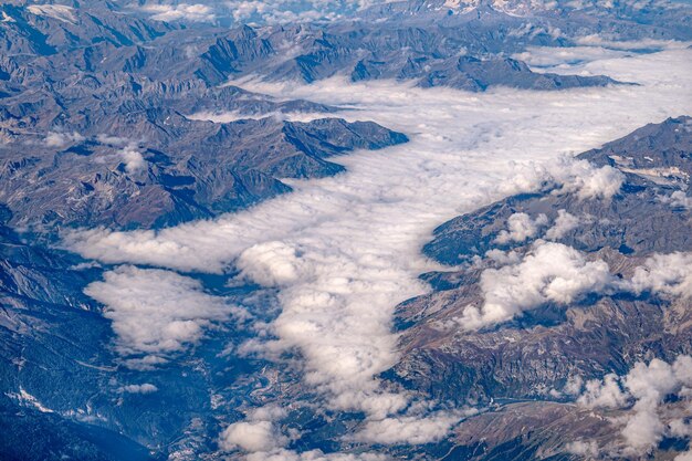 High angle view of snowcapped mountains against sky