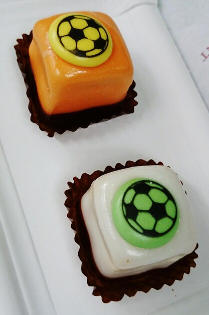 High angle view of soccer ball cupcakes
