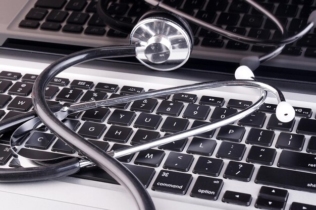 Photo high angle view of stethoscope computer keyboard