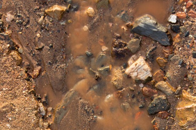 Photo high angle view of stones in muddy water