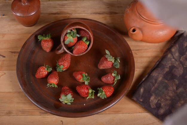 High angle view of strawberries in bowl on table