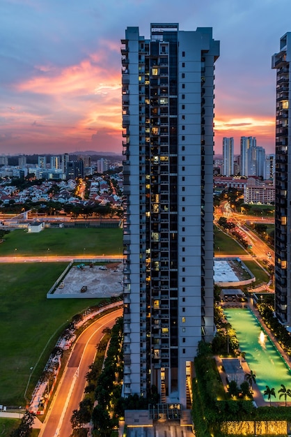 high angle view of street amidst buildings against sky during sunset