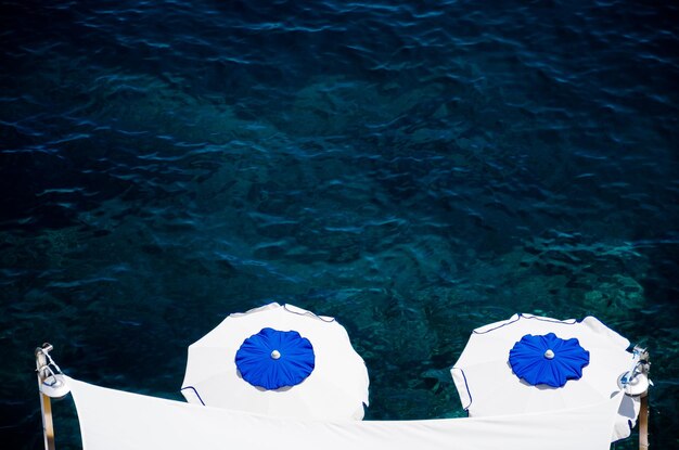 High angle view of sun umbrellas on the sea