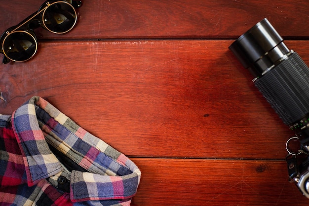 high angle view of sunglasses on hardwood floor